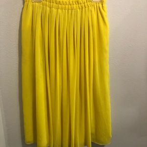 Bright yellow mid length skirt with pockets